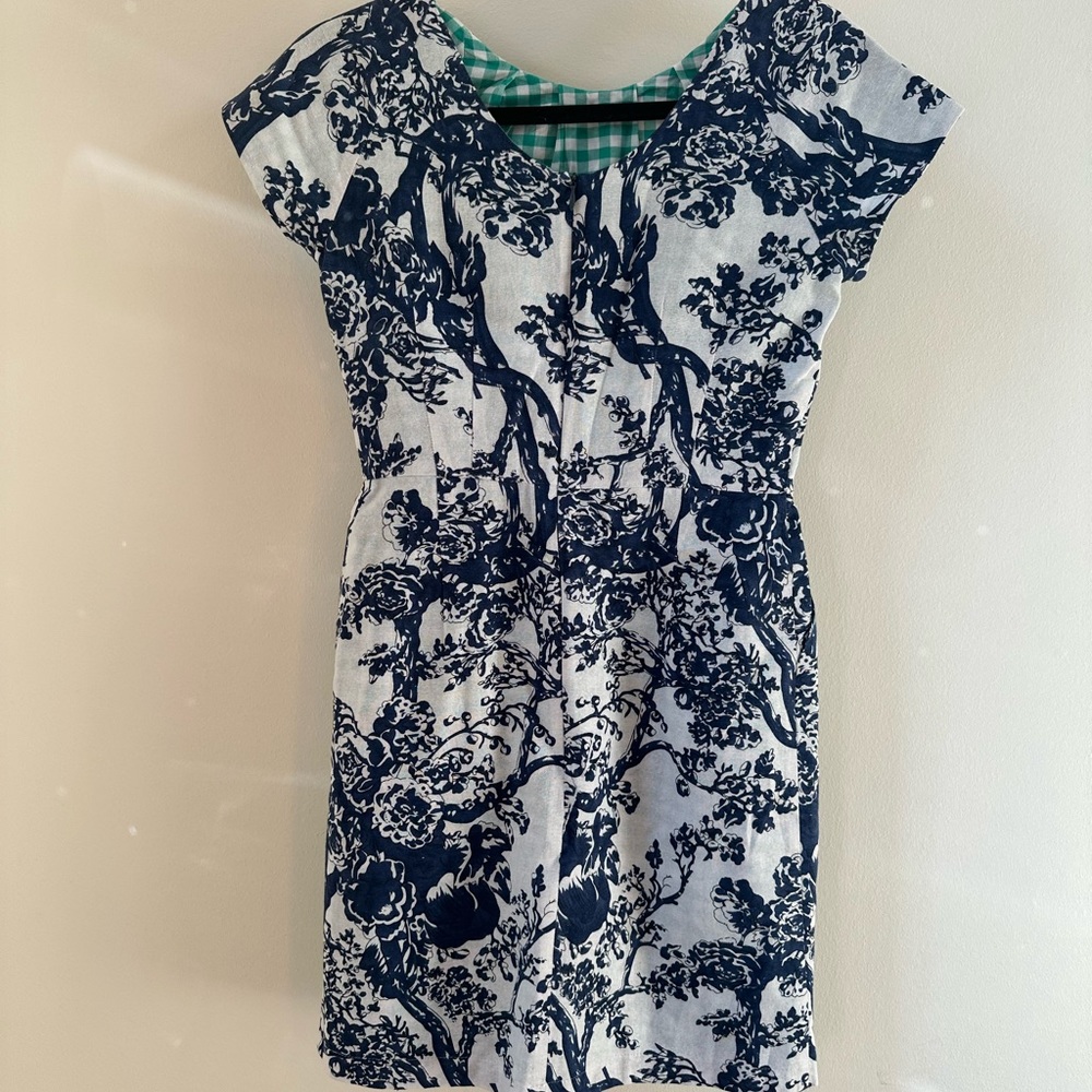 Women’s dress by DEMA blue and white toile dress in size small, with pockets.